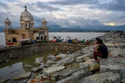 Residents enjoy the view near the floating mosque which collapsed into the sea after being hit by the tsunami on the beach of Kampung Lere, Palu, Central Sulawesi Province, Indonesia. After two years of earthquake, tsunami and liquefaction disasters in Palu, Sigi and Donggala on September 28 In 2018, which claimed more than 5,000 lives, the coastline at the mosque which has been used as a memorial park has now been fortified with embankments to withstand abrasion and tsunami waves. Residents enjoy the view near the floating mosque which collapsed into the sea after being hit by the tsunami on the beach of Kampung Lere, Palu, Central Sulawesi Province, Indonesia. After two years of earthquake, tsunami and liquefaction disasters in Palu, Sigi and Donggala on September 28 In 2018, which claimed more than 5,000 lives, the coastline at the mosque which has been used as a memorial park has now been fortified with embankments to withstand abrasion and tsunami waves.