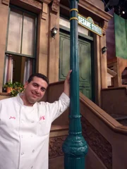 Sesame Street Cake. Buddy poses next to the famous Sesame St sign.