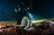 A diver inspects the bell of the Steuben, found after over 70 years in the Baltic Sea.