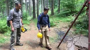 L-R: Rob Nelson and Stefan Burns examine an entrance to one of the Project Riese tunnels in Poland. They will rappel in through a ventilation shaft to enter the tunnels in the Włodarz complex. L-R: Rob Nelson and Stefan Burns examine an entrance to one of the Project Riese tunnels in Poland. They will rappel in through a ventilation shaft to enter the tunnels in the Włodarz complex.