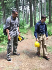 L-R: Rob Nelson and Stefan Burns examine an entrance to one of the Project Riese tunnels in Poland. They will rappel in through a ventilation shaft to enter the tunnels in the Włodarz complex.