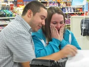 Jose surprises Briana with a very special coupon binder.