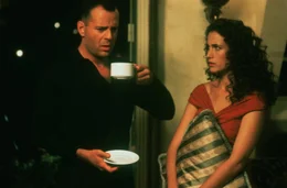 Hudson Hawk (Bruce Willis, l.); Anna Baragli (Andie MacDowell, r.)