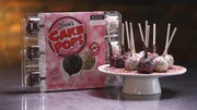 It takes plenty of icing, slabs of cake, and a machine called the 'encruster' to make a single batch of 2,700 bite-size cake pops.