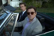 L - R: Joe Hunt (Ansel Elgort), Dean Karny (Taron Egerton)