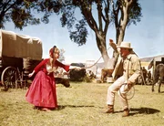 L-R:  Lilith Prescott (Debbie Reynolds), Roger Morgan (Robert Preston)