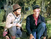 L-R: Confederate Deserter (Russ Tamblyn), Zeb Rawlings (George Peppard)