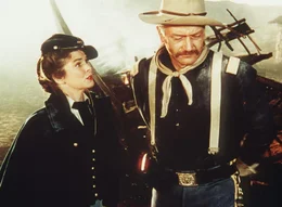 Olivia Dandridge (Joanne Dru), Capt. Nathan Cutting Brittles (John Wayne)