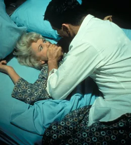 Was will Jerry Webster (Rock Hudson, r.) von seiner Konkurrentin Carol Templeton (Doris Day, l.)?