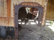 Remains of the USS Arizona's superstructure (shot 2 of 2). The remains are kept in a restricted area behind locked gates on the Navy base at Ford Island, Hawaii.