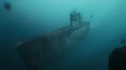 German U-Boat, U840, cruising towards the camera through an underwater mine field.
