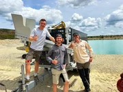 L-R: Benni, Tobi and Andreas Macherey with their self-developed mobile gold washing plant. At a gravel pit.