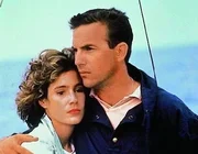 L-R: Susan Atwell (Sean Young) und Tom Farrell (Kevin Costner)
