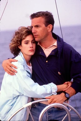 L-R: Susan Atwell (Sean Young) und Tom Farrell (Kevin Costner)