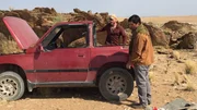 Grady Powell and Bill MConnell checking out the vehicle in the Namib Desert.