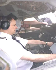 Actor Howard Teale portrays Co-pilot Alastair Atchinson as he tries to control the plane while actor Robert Curbishley depicts steward Simon Rogers fight to hold on to the Captain Lancaster's legs.  Rogers took over from an exhausted Ogden.