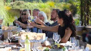 Shawn Finch and Alliya de Lima Batista cheers to a toast with their guests at their engagement party. Shawn Finch and Alliya de Lima Batista cheers to a toast with their guests at their engagement party.