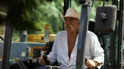 Close-up of Marty Raney looking serious while operating the excavator. Close-up of Marty Raney looking serious while operating the excavator.