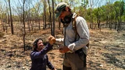 Andreas Macherey congratulates his son Tobi on finding a large nugget in Australia, Northern Territory