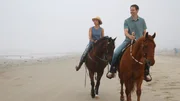 Contributors Laura Kasper (L) and Craig Kasper (R) enjoy horseback riding on the beach in Surfside Beach, Texas, as seen on HGTV's Beachfront Bargain Hunt. Contributors Laura Kasper (L) and Craig Kasper (R) enjoy horseback riding on the beach in Surfside Beach, Texas, as seen on HGTV's Beachfront Bargain Hunt.