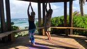 Exterior, Kennard and Wendy doing yoga in Utila, Honduras, as seen on HGTV's Caribbean Life.