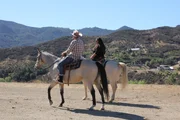 Host Antonio Ballatore rides off into the sunset with ranch owner Pria.