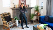 Host Shea Hicks-Whitfield in the finished living room space of the London House, as seen on Bargain Block, Season 4.