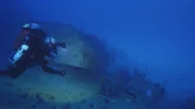 One of the divers find the underwater remains of the SAKAWA. One of the divers find the underwater remains of the SAKAWA.