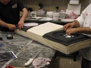 Buddy & Joey work on turntable DJ Cake.