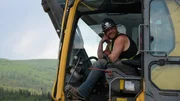Rick Ness smiling in the excavator.