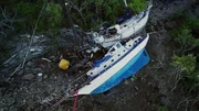 The pros hook up another watercraft in the mangroves.