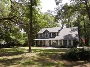 Exterior shot of the frontyard and façade of this two floor town house, possible house