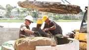 John "Old Man" Messner, Jane "Woman" Werley, and Chris "Crash" Warren install rocks.