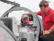 Bobby gets last minute advice before take-off.