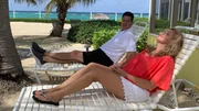 Contributors Matt McCulty (L) and Leigh Ann McCulty (R) bask in the sun following their tour of The Big Chill as seen on HGTV's Beachfront Bargain Hunt.