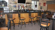 A before shot of the bar area in Stella's, as seen on Food Network's Restaurant: Impossible, Season 12.