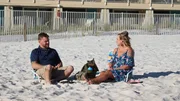 Contributors Denia Meyer (R) and Gene Meyer (L) sit on the beach and discuss all the beach homes they toured as they decide which one to purchase (HGTV's Beachfront Bargain Hunt).