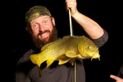 Eric Young posing with a large fish.