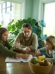 Larry helping Kendra and Alysha do homework. Larry helping Kendra and Alysha do homework.