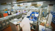 High shot of staff in kitchen preparing meals. (National Geographic/Sean Carswell)