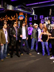The cast of the show Tanked  welcomes Christina Vitagliano the founder of Kiss monster Mini Golf and the band members of Kiss to the unveil of the Kiss fish tank at the Kiss Monster Mini Golf Course in Las Vegas, Nevada.