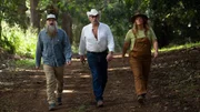 Portrait of Matt Raney, Marty Raney, and Misty Bilodeau walking down a paved path in the forest during hero shots.