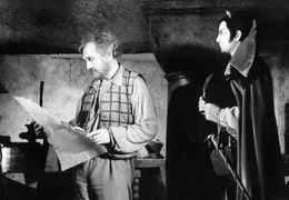 Meister Hans R&ouml;ckle (Rolf Hoppe, li.) und Mister Flammfu&szlig; (Peter Aust).