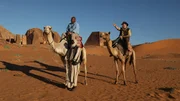 Josh Gates rides camel to Meroe