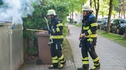 Robert Zimmer and Simon Falkner are on duty at a burning trash can. Robert Zimmer and Simon Falkner are on duty at a burning trash can.