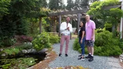 David Bromstad, left, shows Tuk and Brian Kutz the backyard garden in a home in Coupeville, WA on Whidbey Island as seen on My Lottery Dream Home. David Bromstad, left, shows Tuk and Brian Kutz the backyard garden in a home in Coupeville, WA on Whidbey Island as seen on My Lottery Dream Home.