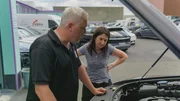 Pam and Norman at the engine bay of the VW Touareg