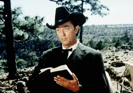 Der Wanderprediger Rudd (Robert Mitchum) kann mit der Waffe besser umgehen, als mit der Bibel ...