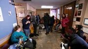 Veterinary waiting room full of patients.