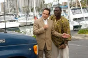 L-R: Adrian Monk (Tony Shalhoub), Samuel Waingaya (Adewale Akinnuoye-Agbaje )